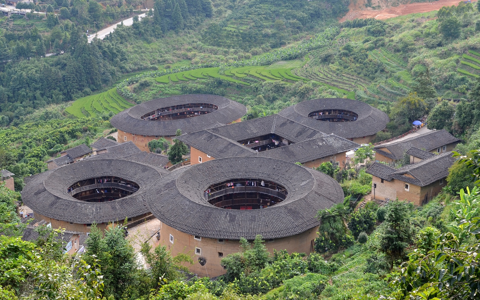 The real reference photo used to generate the T-Agent image: the Tianluokeng Tulou Cluster from above